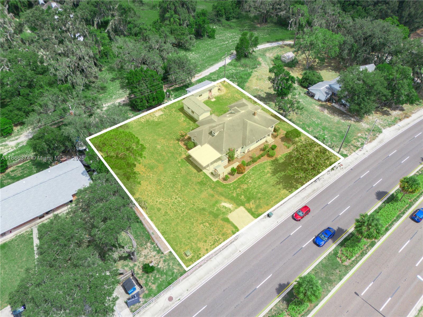 Prime commercial opportunity in the heart of growing Lake Alfred! This freestanding 2,300 sq ft building on Lake Shore Way S sees over 40,000 vehicles daily, offering excellent visibility and signage. Interior highlights include hardwood floors and a private office with lake views. Two detached structures provide flexible options—ideal as studio apartments, offices, or rental units. Perfect for retail, office, showroom, or specialty services, with strong traffic and high demand in this booming area. Great road frontage ensures maximum exposure. Owner financing may be available for qualified buyers. Don’t miss your chance to secure a high-visibility location in one of Lake Alfred’s busiest commercial corridors!