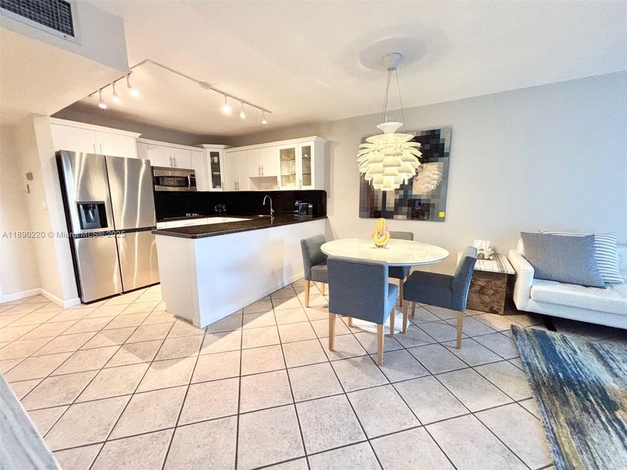 Welcome to this spacious & beautifully updated 1-bedroom, 1.5-bathroom condo in one of the area's most sought-after resort-style communities. This stunning unit features an open-concept white kitchen with granite countertops & s/steel appliances, tiled floors , new bathrooms & ample closets. Owned seasonally by a snowbird, the unit is in impeccable condition & is being sold fully furnished for your convenience!  Enjoy world-class amenities including two heated pools, a state-of-the-art fitness center, a courtesy shuttle bus, BBQ area, tennis courts & more. All of this just minutes from the beach, fine dining & shopping. Rent immediately – ideal for investors, full-time or seasonal residents. Don’t miss this rare opportunity to own a move-in-ready gem in a prime location!