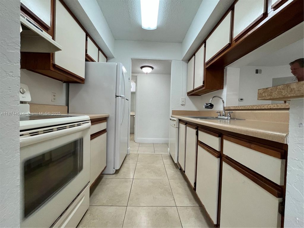 Photo of 5740 Rock Island Rd #273, Tamarac, FL 33319 (MLS # A11874452)