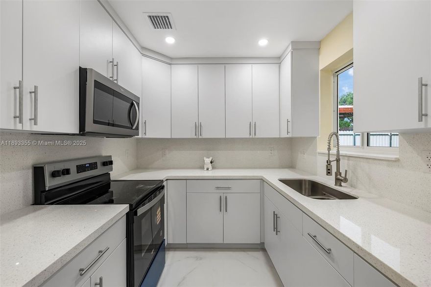 Meticulously Remodeled 4-Bedroom, 2-Bath Home in Miami Gardens! This home features modern upgrades including recessed lighting, impact windows, and a newer AC system. Enjoy a large backyard perfect for entertaining, relaxing, or outdoor fun. The kitchen will feature brand-new stainless steel Whirlpool appliances installed at closing, adding a sleek, modern touch. Conveniently located near major shopping centers and highways, this home offers style, comfort, and an unbeatable location. Move-in ready and waiting for you!