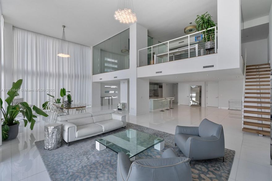 Experience luxury living at its finest in this exquisite 3-story penthouse located in the heart of downtown. Boasting 4,264 SQFT of sophisticated design, this stunning residence offers 3 bedrooms, 5.5 bathrooms, & breathtaking panoramic views of the ocean, bay, & city skyline.
The first floor features a modern open-concept layout with a sleek kitchen, spacious living & dining areas, & a welcoming guest bedroom with a full ensuite bath. Ascend to the second floor to discover the expansive master with luxurious ensuite featuring a double vanity and a standing shower. The true highlight of this penthouse is the third-floor terrace, a private oasis featuring a sparkling pool, a fully equipped bar with a sink & refrigerator, & ample space for entertaining while enjoying the iconic skyline.