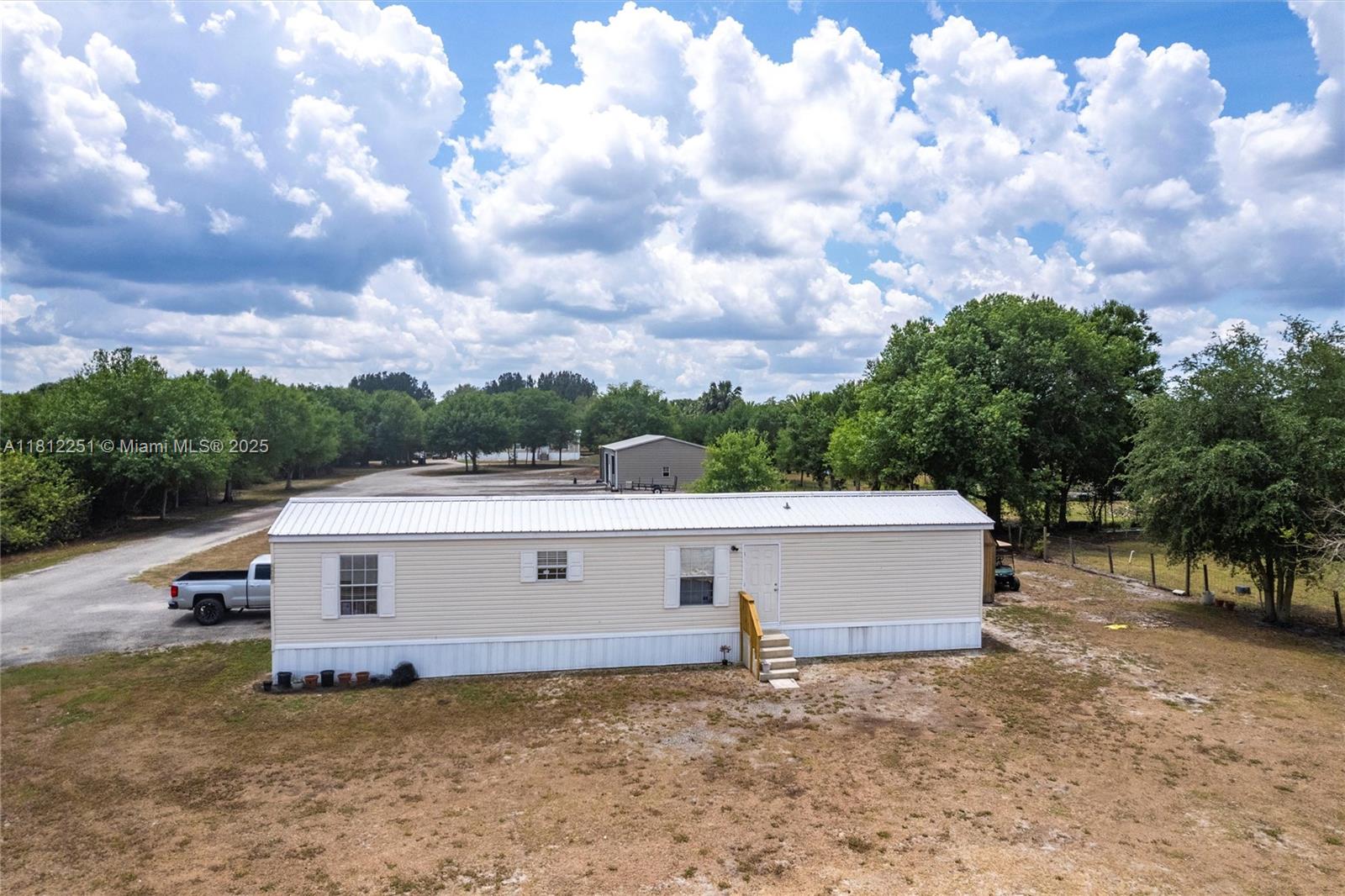 2012 single-wide mobile home offering 2 bed, 2 bath, 840 sq. ft. This home sits on 1.41 acres. Great for extended family, guests, or rental income potential. Additional Features: Steel Metal Building (2019): 1,200 sq. ft. with two oversized bay doors—perfect for a workshop, garage, or storage for equipment and vehicles. Storage Shed (2015): 160 sq. ft. of extra storage space.