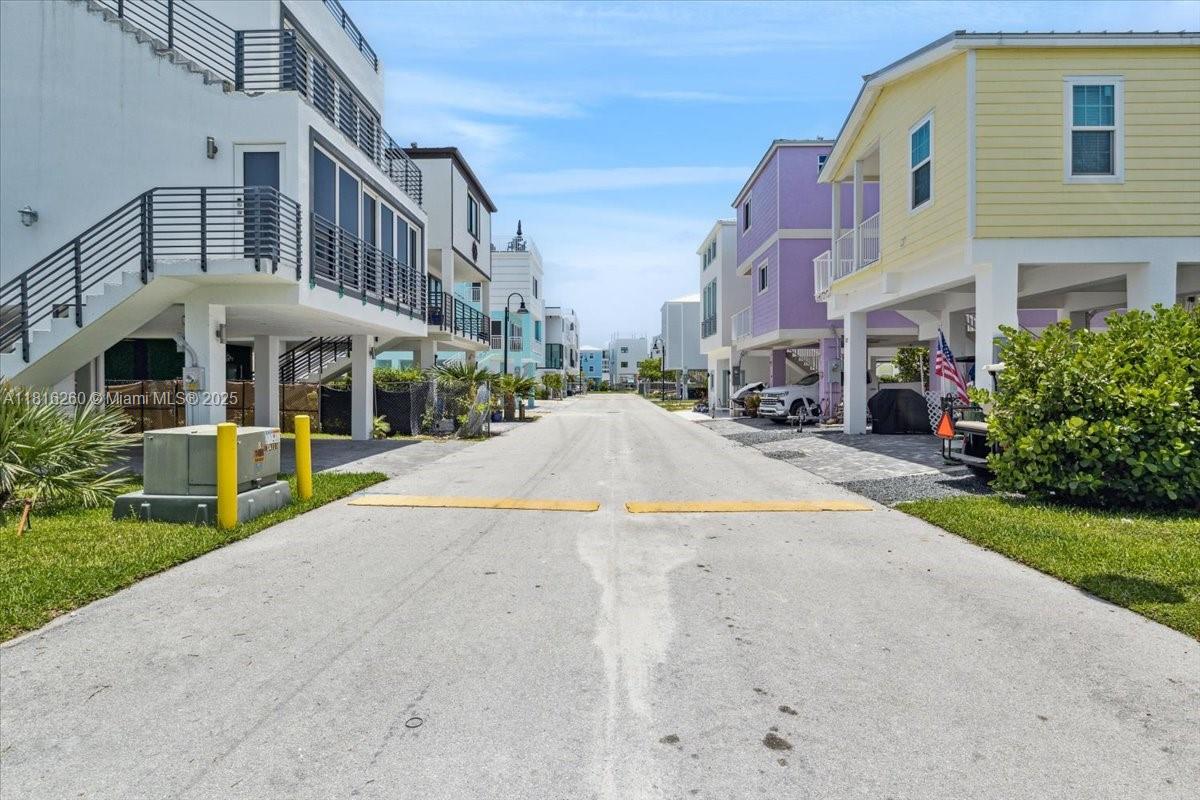 Design a custom luxury retreat on Lot 70 in prestigious Key Largo Ocean Resort. This prime cleared lot offers space for a multi-level residence with covered parking, just steps from the oceanfront marina with direct access to the Atlantic with no bridges to ocean. Enjoy resort-style amenities: gated entry, clubhouse, pool, gym, courts, pier and private beach. Ideal for elegant island living or high-end short-term rental investment.