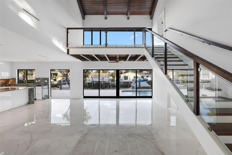 Stunning fully remodeled waterfront home in desirable Snug Harbor with ocean access via canal (1 fixed bridge –
Federal Hwy). Located on a quiet dead-end street with no HOA. This move-in-ready residence features a modern
open-concept layout with vaulted ceilings, brand new chef’s kitchen with granite countertops, new flooring
throughout, and fully renovated spa-style bathrooms. Impact windows and doors provide security and energy
efficiency. Enjoy true South Florida waterfront living with a 70' waterfrontage, and direct access to the Intracoastal
and ocean. Private backyard oasis includes a resort-style pool and new pavers. Additional features include a stonecoated steel roof , office on main level, spacious primary suite with loft, walk-in closet, and 2 car garage.
Conveniently located near beaches, dining, shopping, and major highways. A rare opportunity to own a turnkey
waterfront home