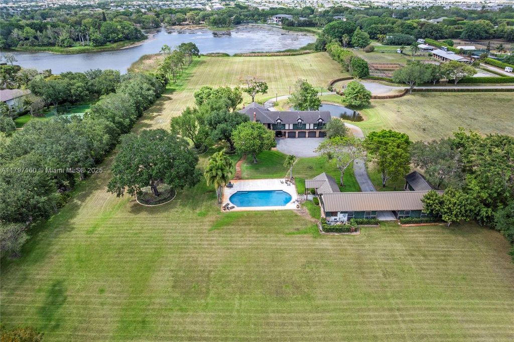 Photo of 8700 Surrey Ln, Boca Raton, FL 33496 (MLS # A11797160)
