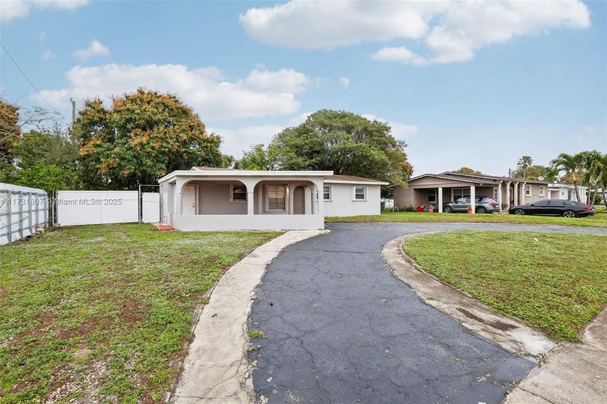 Welcome to your ideal Miami Gardens home! This 3-bedroom, 2-bath property perfectly blends comfort, convenience, and outdoor potential. Featuring a half-circular driveway and carport, parking is a breeze. The primary suite offers an en-suite bathroom with a relaxing tub-and-shower combination, while each bedroom includes spacious closets. The kitchen is equipped with an electric range, sleek hood, and space for a two-door refrigerator. Sliding glass doors lead to a large backyard oasis with fruit trees, perfect for entertaining or relaxing. Conveniently located near shops, restaurants, and attractions, this home combines practicality with an unbeatable location, making it a must-see!