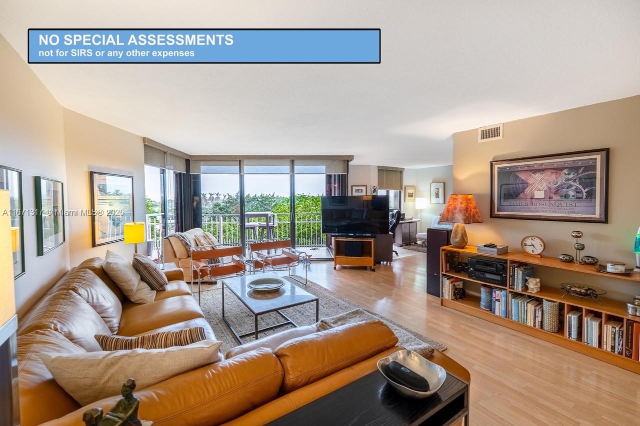 This stunning unit on the 7th floor boasts a serene southeast view, giving you the feeling of living in a treehouse surrounded by lush greenery and tranquil water vistas. this expansive layout is perfect for social gatherings, and with ease, it can be converted into a 2-bedroom. The open kitchen features elegant quartz countertops, blending style and functionality. Located in a well-maintained, gated community of 33 acres on the water, tennis, racketball, pickleball courts, and a full spa with daily classes like yoga, spinning, Zumba, aqua aerobics, everything you need is right at your doorstep. The monthly maintenance fee covers, water, high-speed internet, cable, HBO, and showtime, and best of all, there are no assessments in the building, ensuring peace of mind for residents.