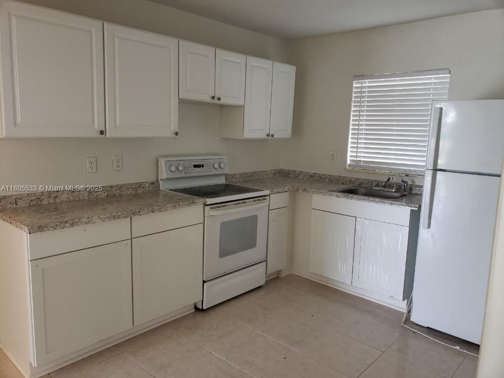 Photo of 147 W 24th St #147, Riviera Beach, FL 33404 (MLS # A11805533)