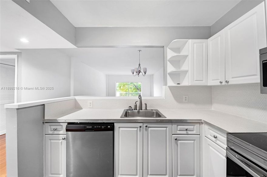 Bright and spacious 1 bed / 1 bath condo offering 827 SF in the heart of North Bay Village. This well-maintained residence features wood flooring in the living area, carpet in the bedroom, and a private balcony. Enjoy a secured waterfront community with a Bayfront pool, fitness center, and assigned parking. Currently rented for $1,950/month through February 17, 2026, with an excellent tenant who would love to stay. Seller will pay off the current special assessment at closing. Building will be undergoing repairs as part of the recertification process.