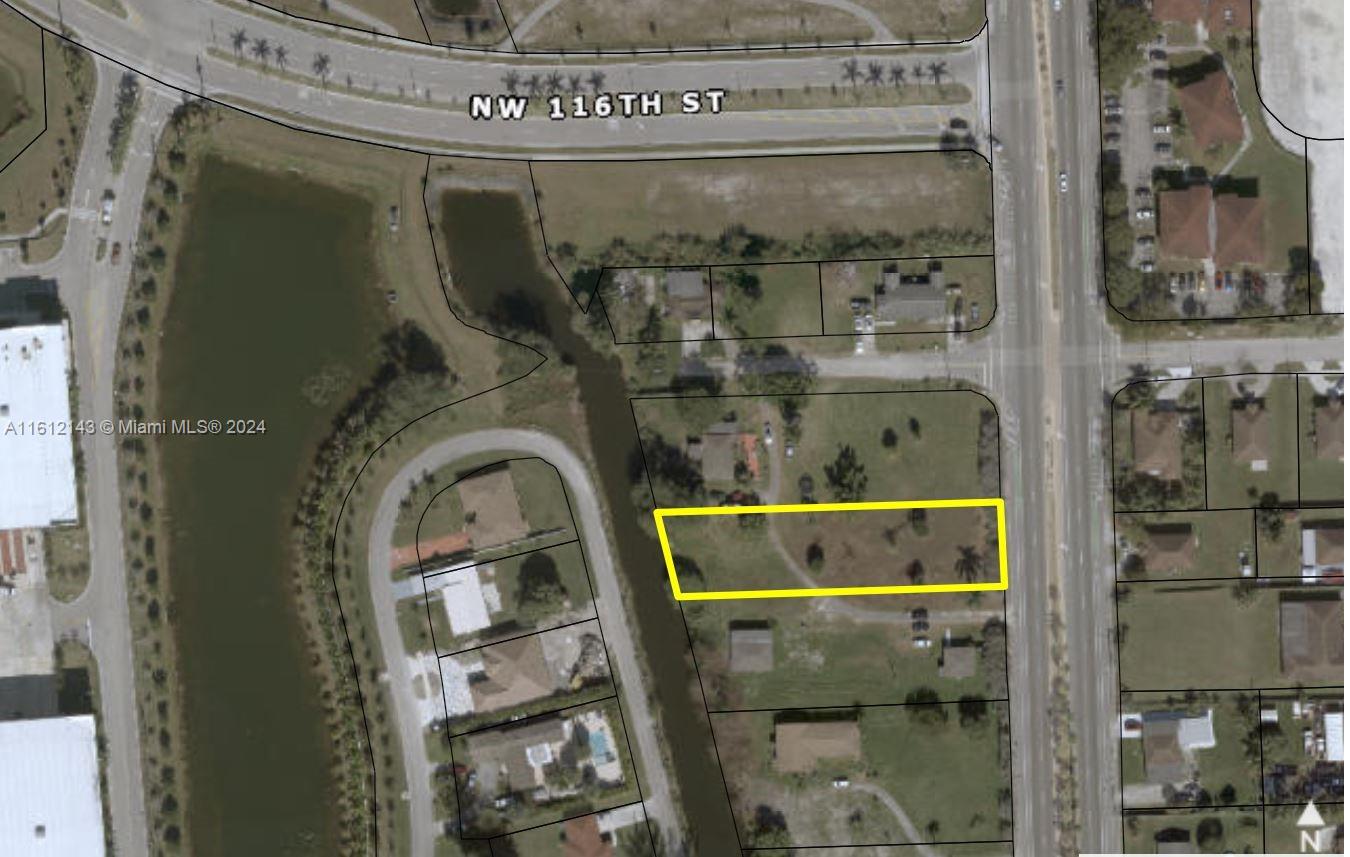 Builder's acre, vacant Residential land with water frontage, ready to build 2 duplexes. Can build up to 44 - 65 units under Miami-Dade work force housing. Comes with a full set of plans for a duplex building if needed.