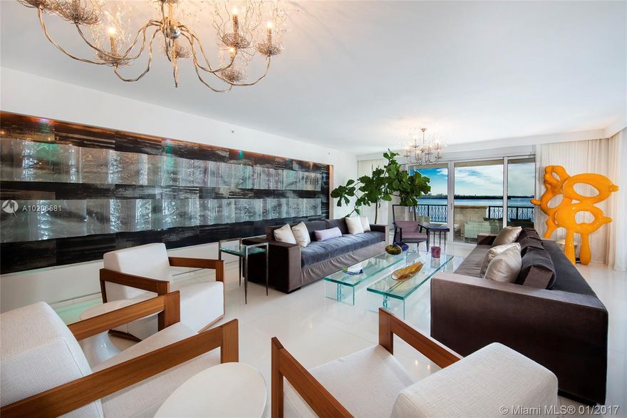 This beautifully designed Bayview residence features a modern artistic decor w/amazing views to Virginia Key, Biscayne Bay & Downtown Miami. The home boasts 4,109 SF of interior space w/exquisite quartz & English oak floors, open spacious living & family areas, private dining room and gourmet kitchen w/top appliances. The master suite faces the bay w/direct balcony access & features an amazing custom made closet-room & magnificent marble master bath. 2 balconies w/amazing sunset views complete this home.