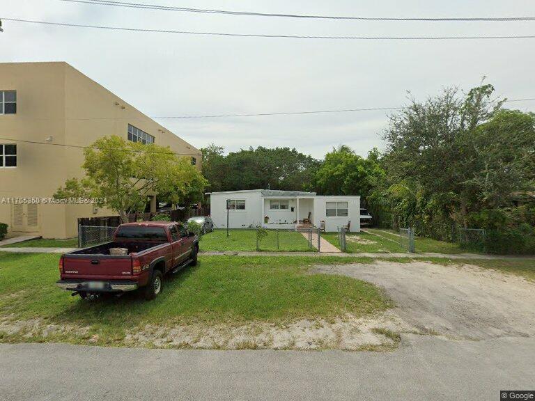 Single family zoned commercial. Oversized lot permits commercial uses in the MU/1B District. New zoning/development laws allow for higher density. Presently rented on month-to-month basis.