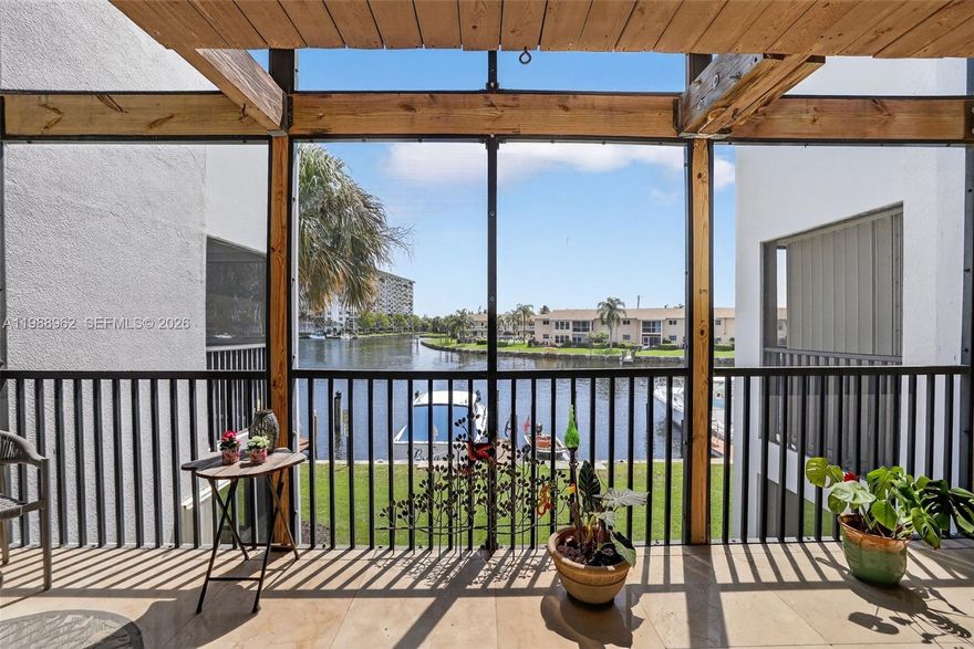 BOATER'S DREAM with deeded dock! Rarely available, this south-facing 2BR/2.5BA residence in the exclusive gated enclave of Nobel Point showcases a new roof and new A/C, refrigerator, water heater, dishwasher, and washer/dryer. Bathed in natural light, this striking waterfront townhome captures mesmerizing views from two oversized, roofed and screened balconies on both levels, defining an elevated coastal lifestyle. The refined interior offers a generous open layout with marble flooring on the main level and thoughtfully updated kitchen and baths. Upstairs, two spacious bedrooms feature en-suite baths, with the primary suite showcasing sweeping waterfront views that create a true vacation-at-home experience. Your deeded dock includes water and electric and accommodates up to a 42’ vessel with swift Intracoastal and ocean access. Residents enjoy resort-style amenities including tennis, pickleball, heated pool and spa, clubhouse, fitness center, tropical outdoor grilling oasis, and car wash. Pet-friendly, allowing up to two pets. Includes parking for two vehicles (one covered, one uncovered). Ideally located approximately 2.5 miles to the beach and moments from premier shopping, dining, and major roadways. This prized south-facing wide-water dock orientation enhances maneuverability for larger vessels and adds enduring value. A true Boating Enthusiast’s Paradise, privately tucked within the beautiful Garden Isles community with ocean access via only one fixed bridge.