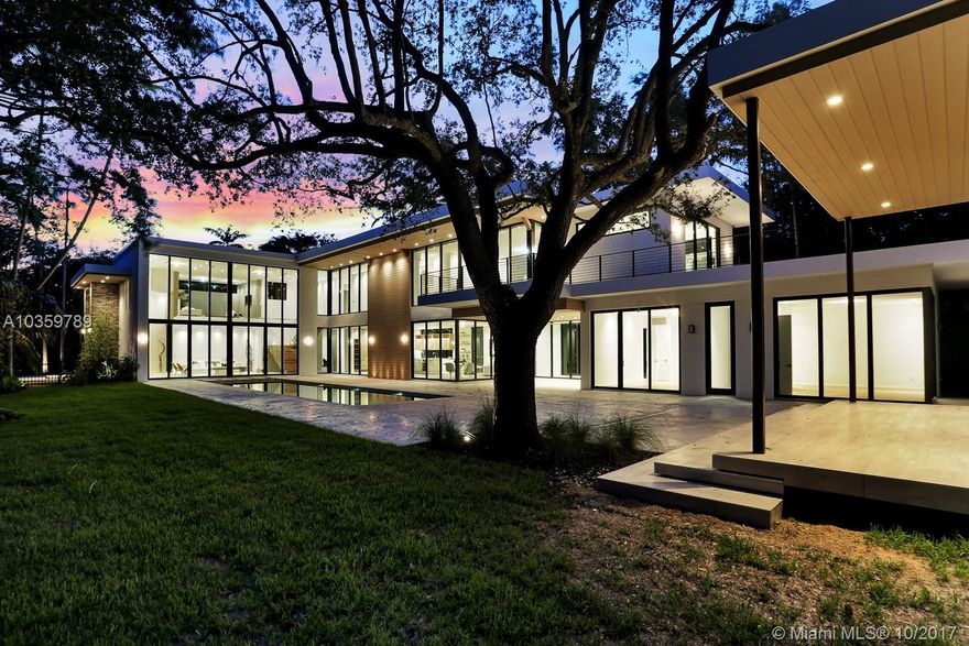 Prime location in North Pinecrest. Unmatched privacy in an urban oasis at end of idyllic cul-de-sac setting. Unique design, inspired by famous German Bauhaus School combined with Miami coolness and the South Florida vibe. Dramatic 22' ceilings, open floor plan with spectacular views from every room and hallway. Make a statement as your guest walk through a glass breezeway to their private two room guest suite. Upstairs home office opens onto gallery overlooking the downstairs living, kitchen offers the highest quality design and Miele appliances and if that was not enough you can take the party outside with an outdoor kitchen and summer lounge.