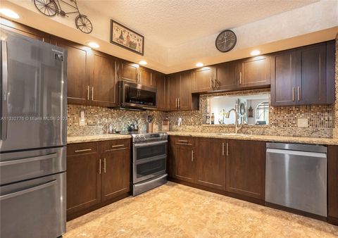 Photo of 1201 SW 128th Ter #309E, Pembroke Pines, FL 33027 (MLS # A11332776)