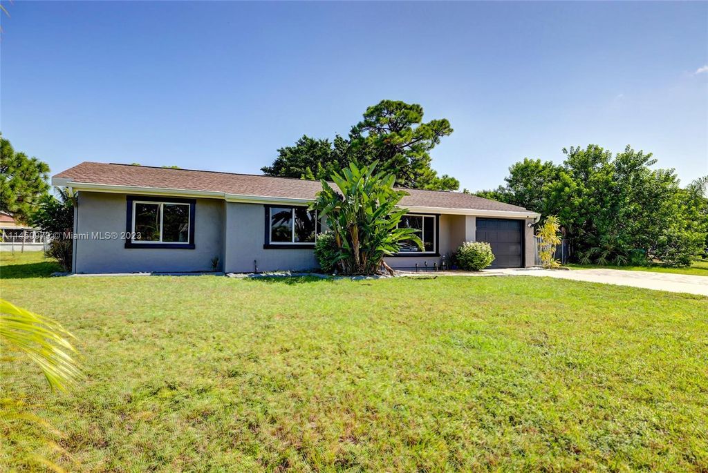 Photo of 245 SW Kentwood Rd, Port Saint Lucie, FL 34953 (MLS # A11450979)