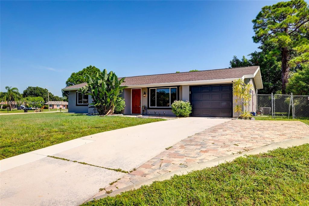 Photo of 245 SW Kentwood Rd, Port Saint Lucie, FL 34953 (MLS # A11450979)