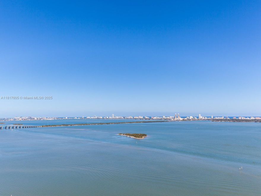 Looking for a spacious bayfront apartment designed for comfort and entertaining? This renovated 2BD/3BA + den corner unit offers panoramic Biscayne Bay views and a smart, flexible layout. A custom built-in bar with wine fridge is perfect for hosting, mixing cocktails, or watching the game with friends. Enjoy an open kitchen, split floor plan, and a generous balcony ideal for sunset cocktails. The primary suite includes a sauna, double rain shower, and in-unit washer/dryer. The Grand offers 24-hour security, large pool, oversized jacuzzi, gym, spa, and direct access to Sea Isle Marina. Dining, shopping, and essentials are right downstairs. One block from the Arsht Metromover, Publix, and Margaret Pace Park with tennis, basketball, and volleyball courts. Schedule your showing today!