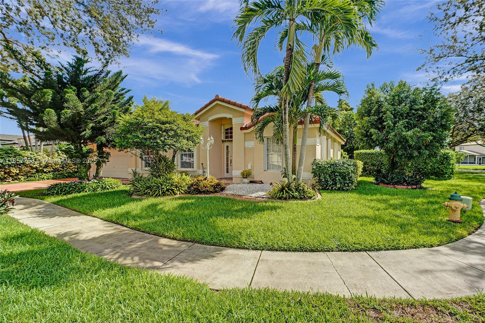 Discover this beautiful lakefront property on an oversized 15,000+ sq. ft. corner lot, offering breathtaking views and endless possibilities. This home features volume ceilings, a galley-style kitchen with granite countertops and stainless steel appliances, and a large covered terrace complete with an outdoor kitchen and masonry grill — perfect for entertaining. 4 community pool, kiddie play area, 24/ security.
Enjoy the lush landscaping with mature assorted fruit trees and the peace of mind of a new barrel tile roof installed in 2023. The spacious 2-car garage comes with built-in cabinets for optimal storage.
From sunrise to sunset, the stunning lake views make this property truly special. Don’t miss the chance to own this unique home in a prime Miramar location!