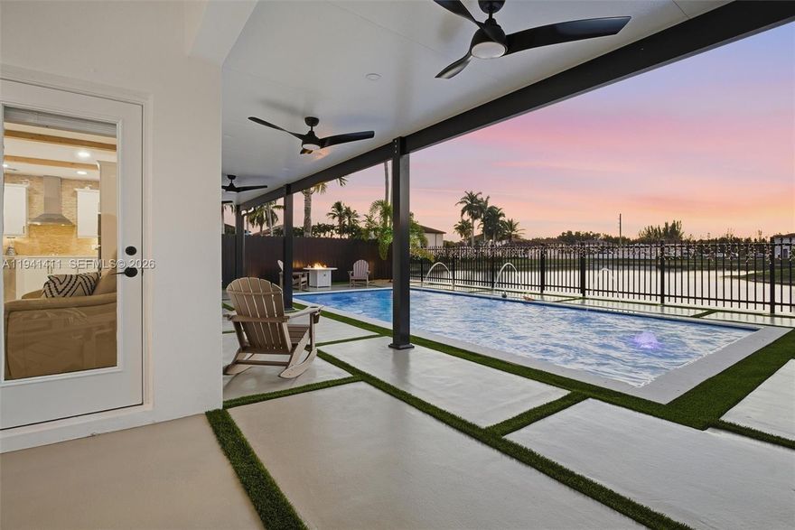 Beautifully renovated 4-bed, 3-bath modern home featuring porcelain floors, high ceilings, a spacious open-concept kitchen, and designer finishes throughout. This property includes a double garage with electric-car charging, a stunning covered terrace, a modern pool with LED lighting, and relaxing waterfront views. Move-in ready with exceptional curb appeal and upgraded details in every corner. (Can be converted into a 5Bed, with 1 bed on the main floor)

Total gross area is 3,170 sqft including the outdoor. It's a unique opportunity to own a spacious residence in a safe, non-HOA community that feels like one. Come see it today!