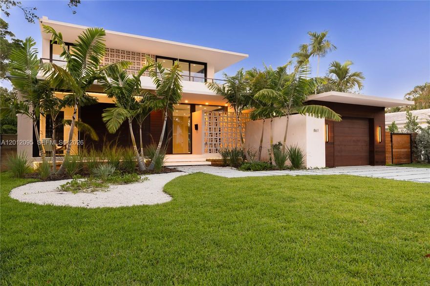Experience the perfect blend of timeless design and modern luxury in this stunning tropical mid-century residence. This exceptional 5-bedroom, 5.5-bath home showcases top-of-the-line finishes throughout, complemented by exquisite custom woodwork in both the kitchen and closets, adding warmth and sophistication to every space.

Designed for both comfort and entertaining, the home features a seamless indoor-outdoor flow that opens to a spectacular pool area. The beautifully crafted summer kitchen creates the ideal setting for gatherings, whether hosting intimate dinners or lively celebrations.

Surrounded by lush tropical landscaping, this property offers a private oasis where style meets functionality. A rare opportunity to own a truly distinctive home that captures attention from the moment you arrive.