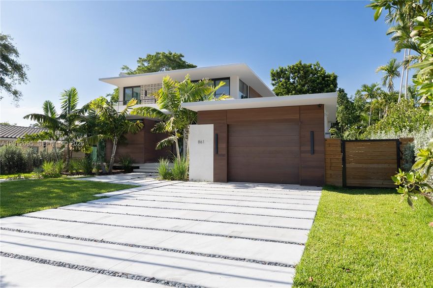 Experience the perfect blend of timeless design and modern luxury in this stunning tropical mid-century residence. This exceptional 5-bedroom, 5.5-bath home showcases top-of-the-line finishes throughout, complemented by exquisite custom woodwork in both the kitchen and closets, adding warmth and sophistication to every space.

Designed for both comfort and entertaining, the home features a seamless indoor-outdoor flow that opens to a spectacular pool area. The beautifully crafted summer kitchen creates the ideal setting for gatherings, whether hosting intimate dinners or lively celebrations.

Surrounded by lush tropical landscaping, this property offers a private oasis where style meets functionality. A rare opportunity to own a truly distinctive home that captures attention from the moment you arrive.