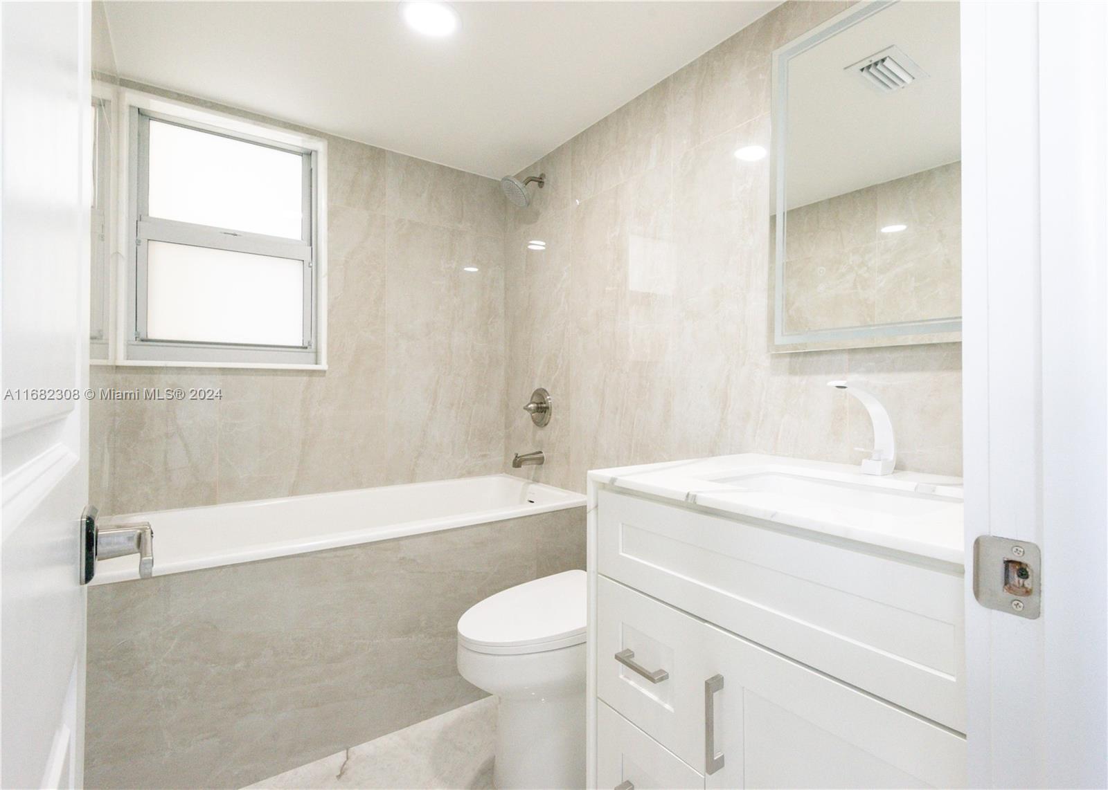 Beautiful fully new renovated condo in East Hollywood! AMAZING LOCATION minutes away from Downtown Hollywood and Hollywood Beach! The unit has new impact windows, new air conditioning and features a large living room with porcelain tiles flooring throughout, kitchen with new stainless steel Samsung appliances, stunning high end quartzite countertops and full backsplash. The dining area wall is covered in porcelain crystal tiles. Guest bathroom features waterfall edge calacata vanity and floor made of porcelain crystal, as well as porcelain crystal walls. Large master bedroom with two large closets, one walk-in. Master bath features porcelain crystal walls, floor and vanity with waterfall edge.
A must see and can be rented right away!