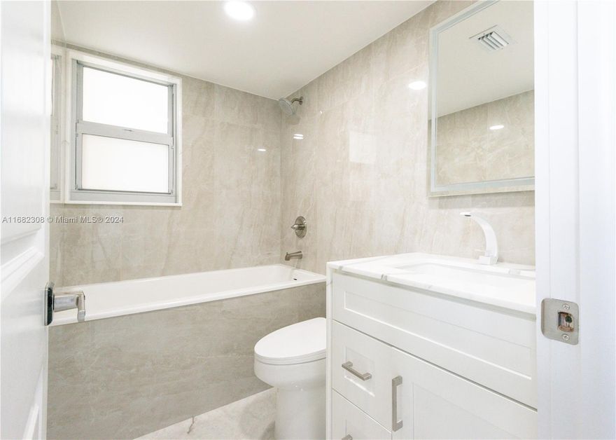 Beautiful fully new renovated condo in East Hollywood! AMAZING LOCATION minutes away from Downtown Hollywood and Hollywood Beach! The unit has new impact windows, new air conditioning and features a large living room with porcelain tiles flooring throughout, kitchen with new stainless steel Samsung appliances, stunning high end quartzite countertops and full backsplash. The dining area wall is covered in porcelain crystal tiles. Guest bathroom features waterfall edge calacata vanity and floor made of porcelain crystal, as well as porcelain crystal walls. Large master bedroom with two large closets, one walk-in. Master bath features porcelain crystal walls, floor and vanity with waterfall edge.
A must see and can be rented right away!