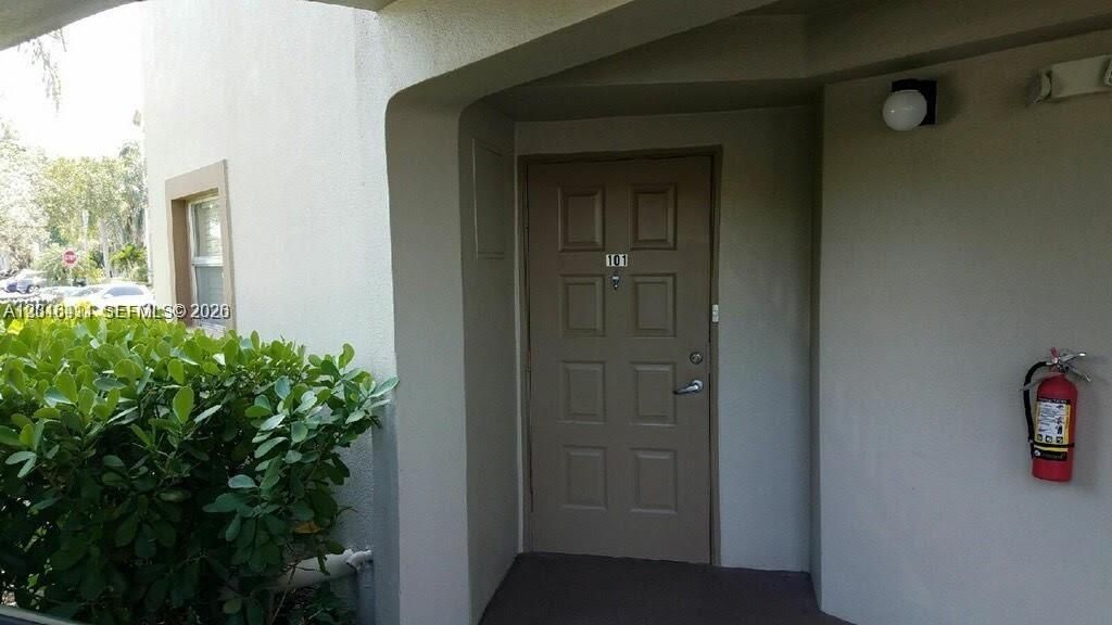 Photo of 550 SW 137th Ave #101L, Pembroke Pines, FL 33027 (MLS # A12016411)