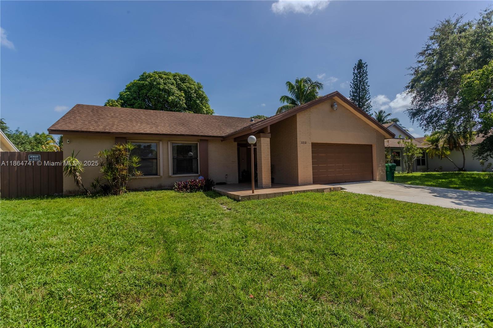 Beautiful and spacious 3/2 single family house, that features a garage converted into a living space, or can also be converted into a large 4th bedroom. This big, well-maintained house offers the unique opportunity to have the privacy of having two homes in one. Two kitchens, two living rooms and two dining rooms. The ample master suit offers a walk-in shower and access to the patio. If you step outside you will find a very ample backyard with fruit trees. This fully fenced backyard comes with a covered bbq area, and plenty of room to add a pool. This big backyard is perfect for gatherings. though out the house, you will find different door access to the back yard. There is plenty of parking space in front of the house. Best of all, No Association Fee! plenty of near shopping and highways!