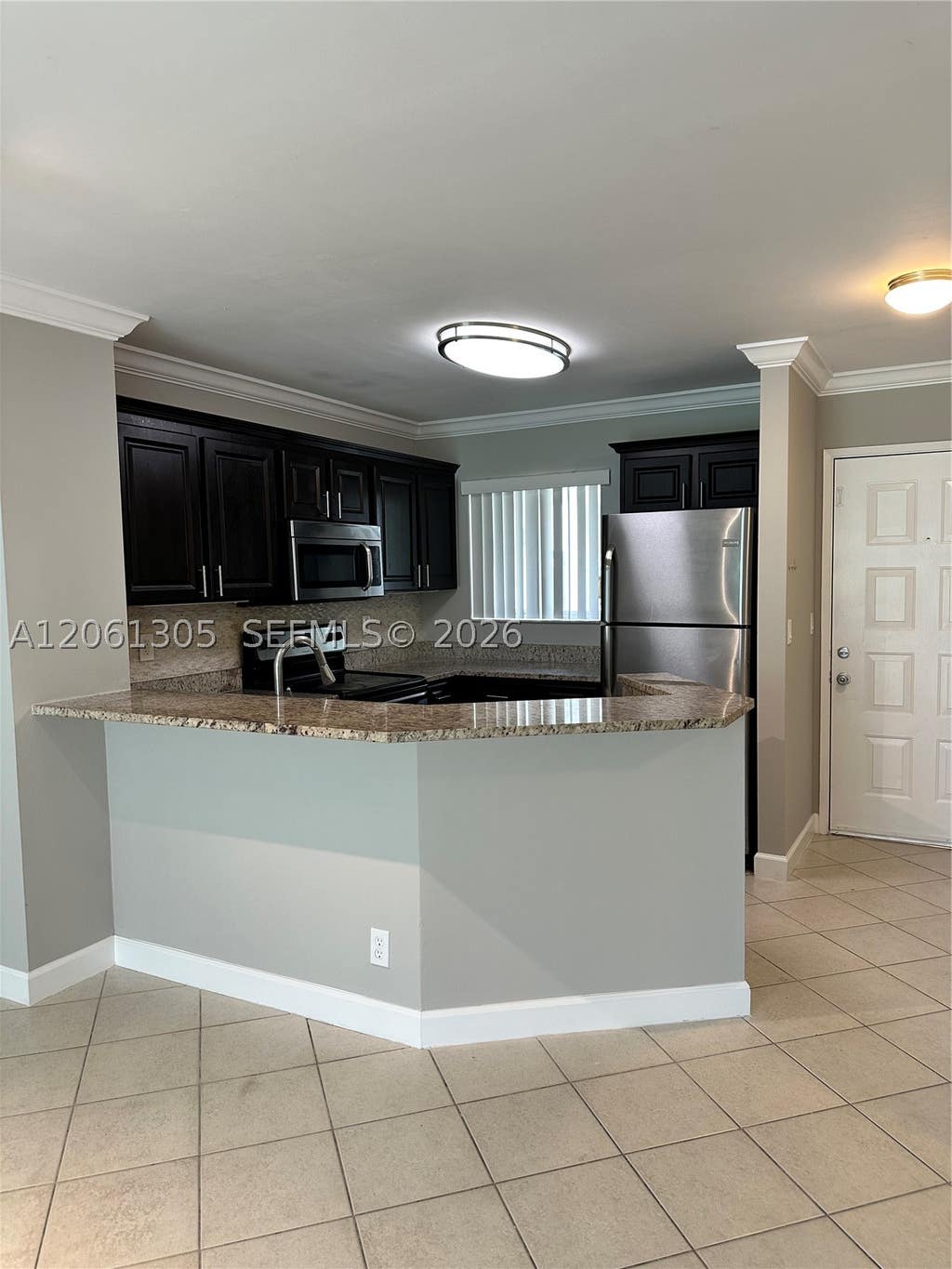Photo of 8750 N Sherman Cir #103, Miramar, FL 33025 (MLS # A12061305)