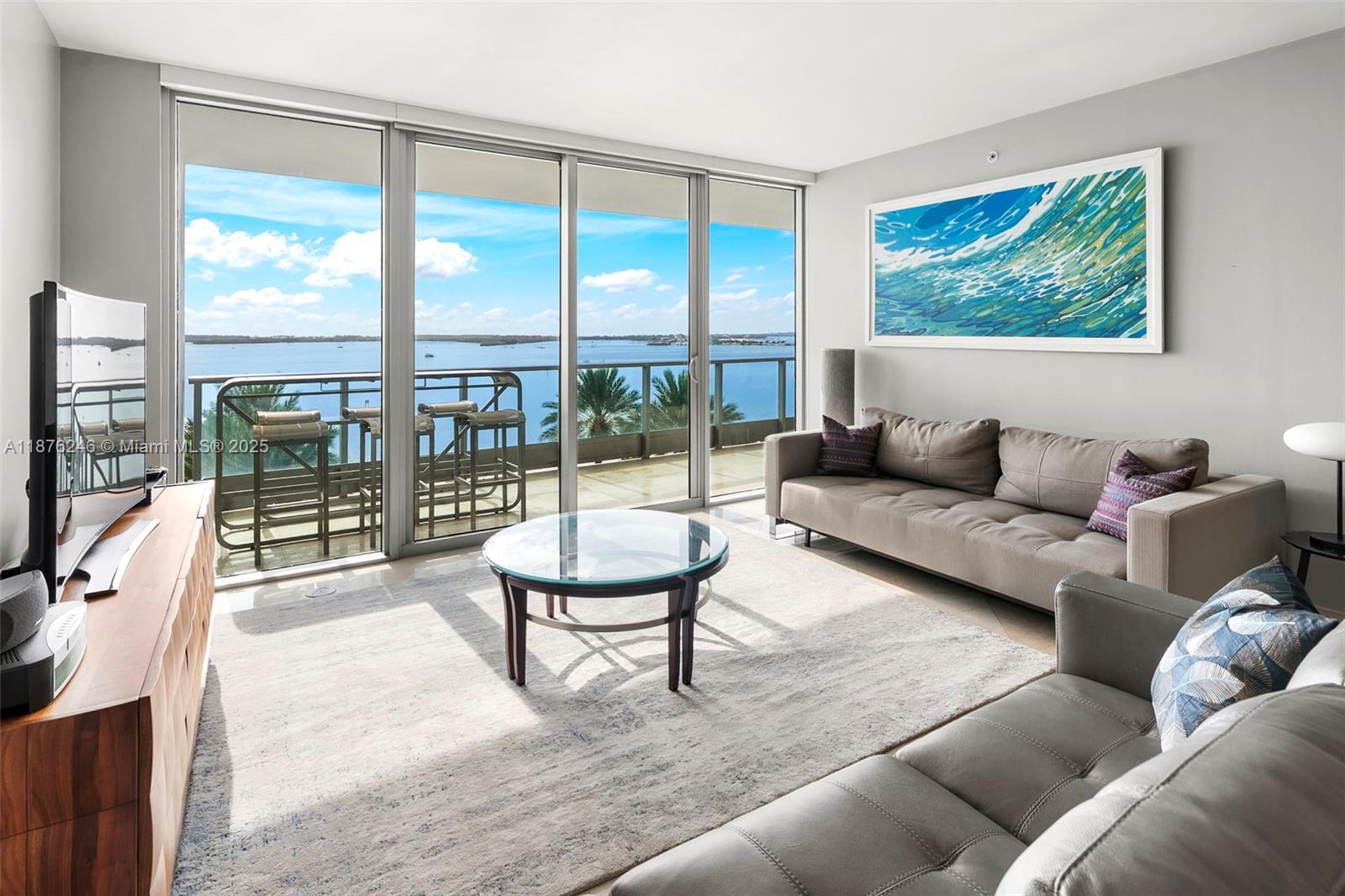 This spacious 1-bedroom residence showcases sweeping, unobstructed Biscayne Bay views through floor-to-ceiling glass and from an oversized private balcony—ideal for outdoor dining and lounging. Interior highlights include marble flooring, a sleek kitchen with breakfast nook and cherrywood cabinetry, motorized shades, and a spa-style bath. A semi-private elevator lobby enhances the sense of exclusivity. Jade’s resort-style amenities feature a rooftop clubroom with panoramic city and bay views, state-of-the-art fitness center, spa, pools, business center, and 24-hour concierge, valet, and security. Steps to Brickell City Centre, dining, shopping, and nightlife—luxury and convenience in the heart of Miami.