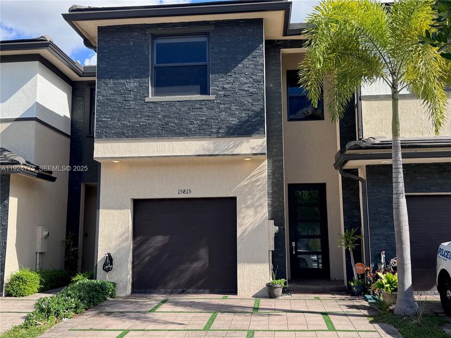 Beautiful 2-story townhouse in the exclusive gated community of Satori in Miami Lakes.with 3 Beds and 2 1/2 Bath.  Features a modern kitchen with quartz countertops, waterfall island, stainless steel appliances, and contemporary cabinetry. Open-concept living area with great natural light. Garage converted into an additional bedroom, perfect for guests or office. Upstairs includes a Master Bedroom with private bathroom, two additional bedrooms with shared bath, and a central laundry area. Resort-style amenities: clubhouse, pool, lake views, and 24/7 security. Located near top-rated schools and Charter Schools, with quick access to I-75, 826, I-95, and the Turnpike. Ideal for families, growing couples, and investors.