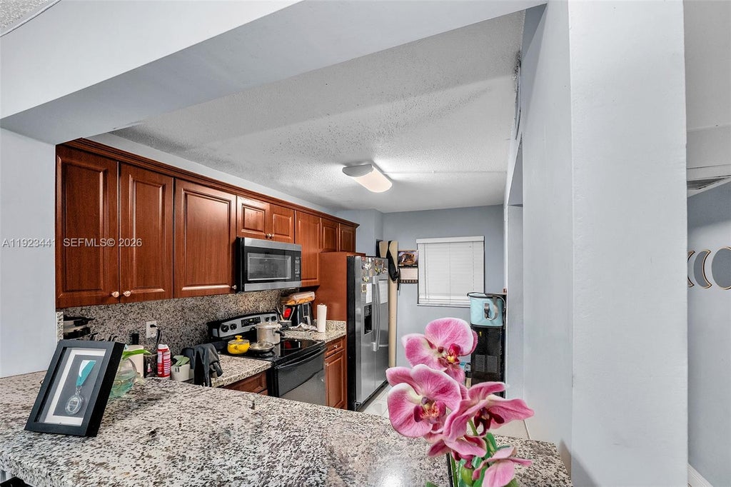 Photo of 9000 NW 28th Dr #1-207, Coral Springs, FL 33065 (MLS # A11923441)
