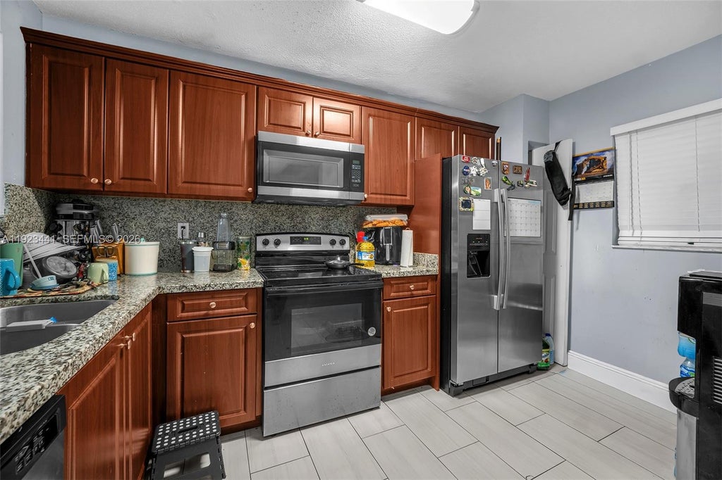 Photo of 9000 NW 28th Dr #1-207, Coral Springs, FL 33065 (MLS # A11923441)