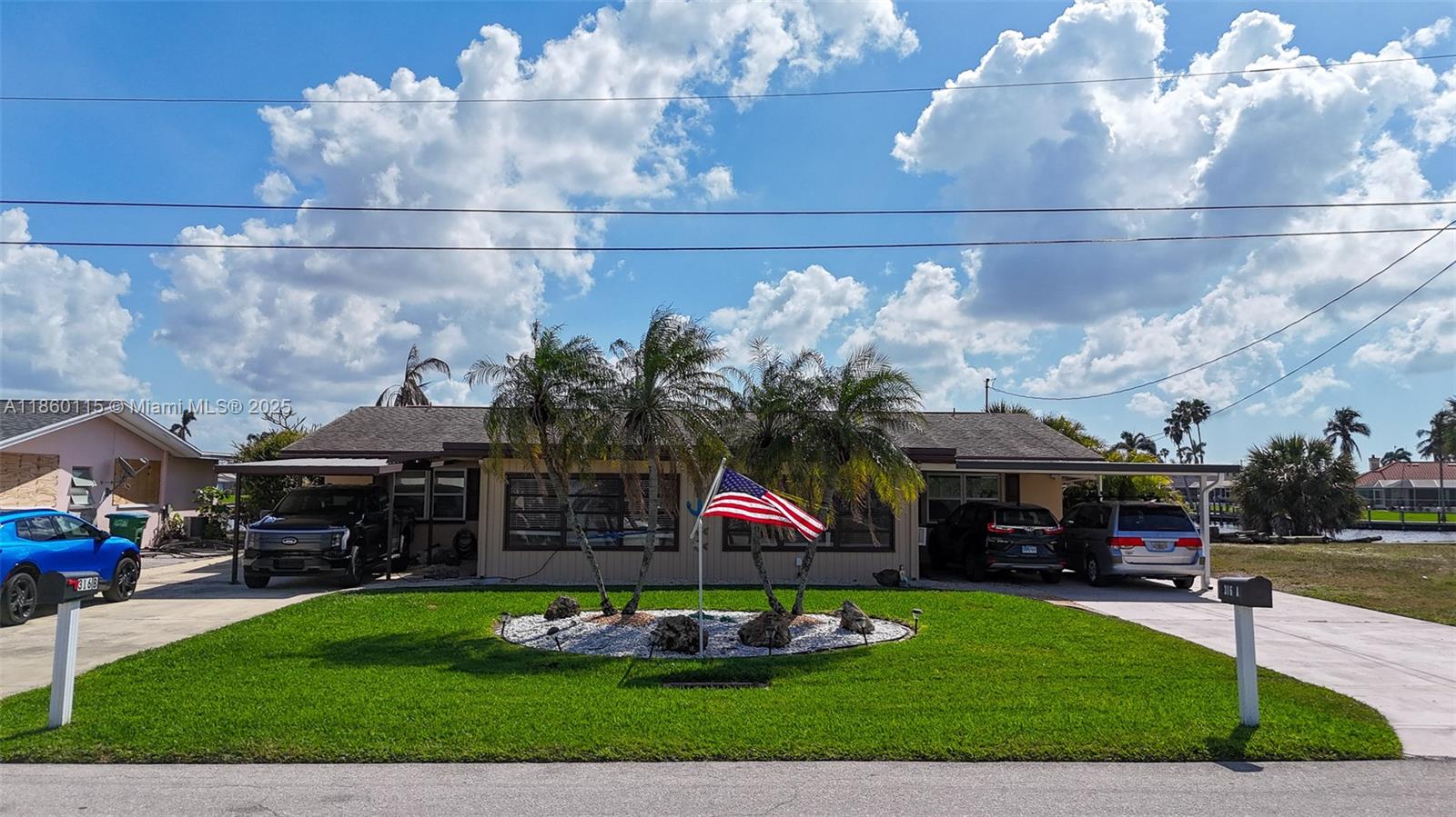 Waterfront! Room for two boats 38 feet or longer. 1 lift & 1 in the water at the pier. More dockage could be added. S/SW view on a 200 ‘+ canal. Gulf access & Approx. 10 minutes idle to the river and 5 miles to open water! Almost 1,000 sq ft covered back porches. Each unit features an under-truss additional room added in the front, which is under air and approximately 320 sq ft. Meticulously maintained by the owner/occupants. New roof installed in 2012. New A/C added to the right unit in 2018, and the left unit in 2009. All new tile floors, new bathrooms & kitchens. Near the Bimini Basin & Four Freedoms park. An investor could collect rent on both sides or live in one, rent the other—covered parking for up to 4 vehicles.