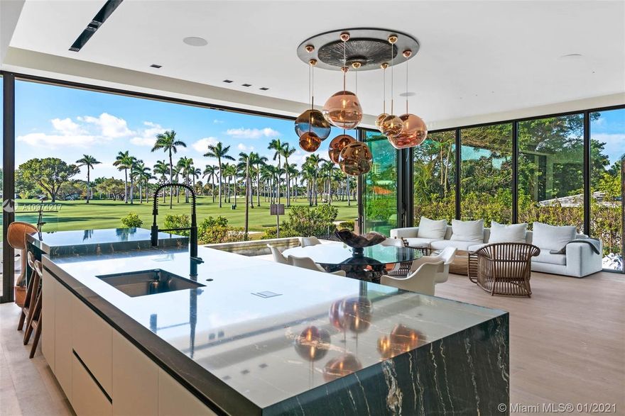 Be the first to live in this newly built tropical modern Ralph Choeff designed residence offering expansive western views of the La Gorce Country Club Golf Course. Situated on the 15th fairway, this home offers a private sliding gate w/direct access to golf course & club house. Completed in 2020, this customizable 4,000SF smart home, set up by Visual Acoustics, offers 4bd/4ba + convertible den/office. No expense spared, designer high-end finishes throughout! Enjoy idyllic sunsets from your expansive flow-through 2nd floor Master Terrace. Master suite boasts gorgeous Calacatta Gold bath w/ custom dressing room. Accordion style floor to ceiling glass panel system brings the outdoors in & extend your living space onto your infinity edge pool deck. A golfer’s dream, this home is one of a kind!