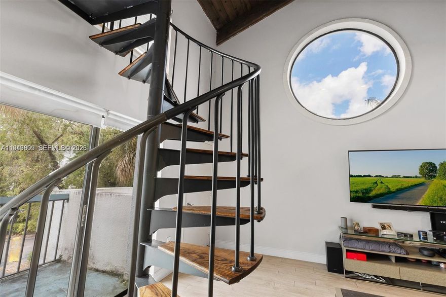 A great opportunity to own a fully renovated property that is move in ready featuring a vast living room/dining area, great kitchen layout w/pantry, W/D, updated bathroom & sliding glass doors for added natural light. A spiral staircase leads to a beautiful large loft-style oversized bedroom featuring a walk-in closet, high vaulted wood ceilings and a private patio on the upper level. perfect for a starter family, student or solo person. Amenities: Swimming Pool overlooking the lake and walk/jog path. Plenty of guest parking. Located in the heart of Kendal in close proximity to Baptist Hospital, A rated schools, & great restaurants. Contact listing agent for more information. (Association has reserves as of 01/01/2026)