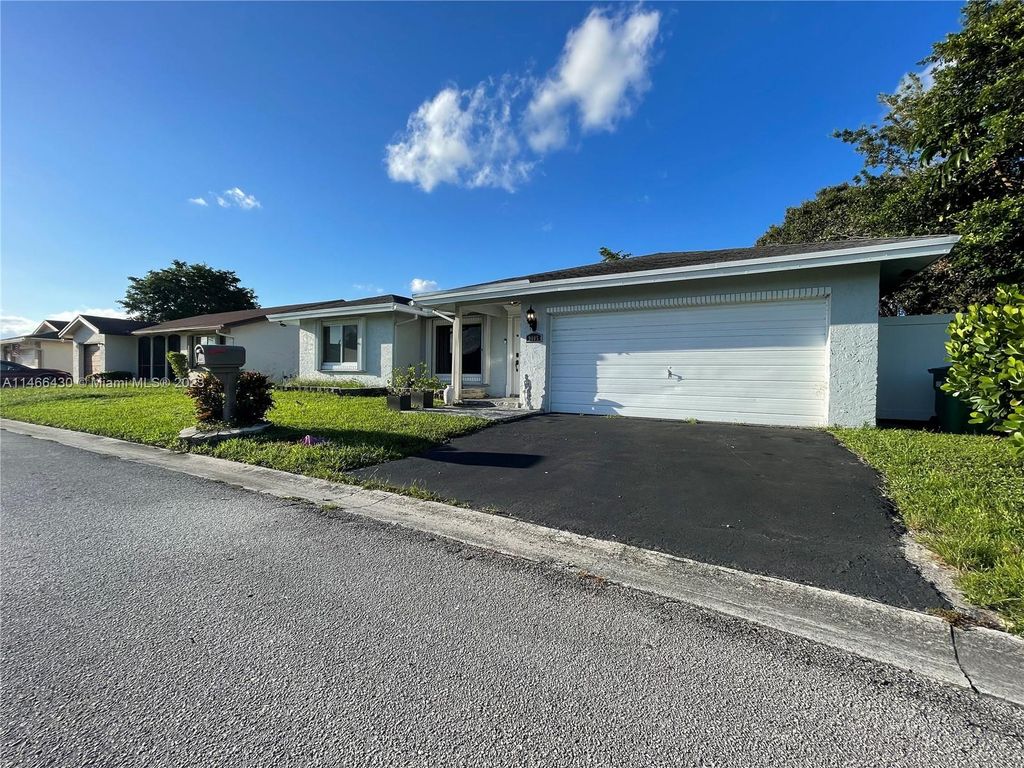 Photo of 9405 NW 83rd St, Tamarac, FL 33321 (MLS # A11466430)