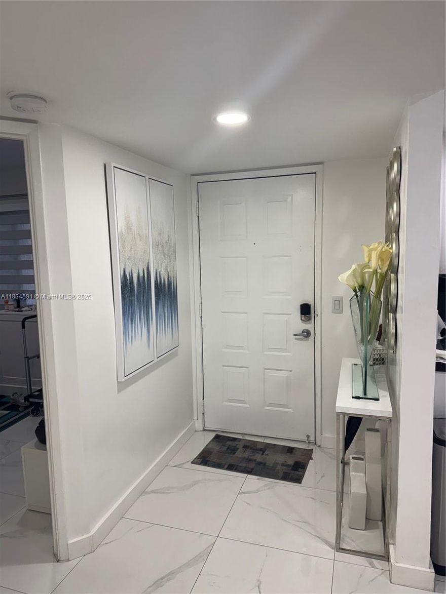 Beautiful first floor unit in well maintained 55+ age community of Century Village.  New kitchen and built-in closet in master bedroom.  Awesome lake view from living room and enclosed balcony.  Impact glass throughout with zebra shades in kitchen, second bedroom and balcony.  Blackout and see through shades in master bedroom.  Owner motivated.