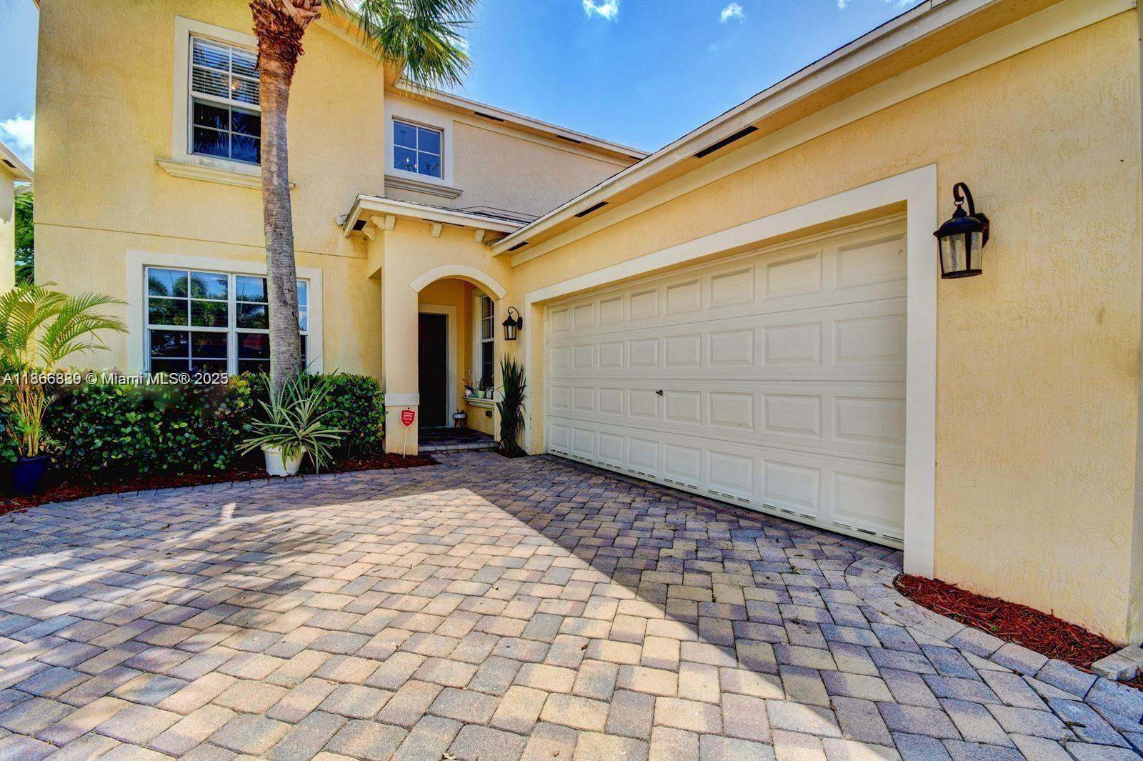Beautiful and exclusive secured community of Sunterra. Located in the heart of West Palm Beach. This is a 2 story, 2 car garage home. Master bedroom is located on the first floor. Large open kitchen with a formal dining room, den on the first floor and laundry room. Hurricane Impact Glass and Doors throughout. Covered patio overlooking a shaded yard. Community pool and fitness center, you can enjoy it all in one location. No Criminal history, minimum 620 credit score, income must be 2.5 monthly rent. Easy to show.
