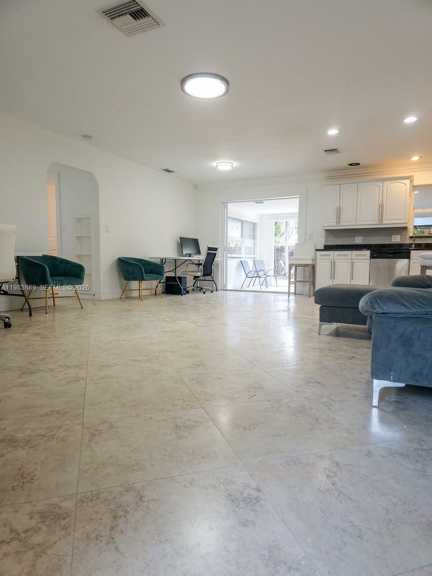 Beautiful and spacious 2BE/1bath home in a desirable Hallandale Beach location close to shopping, the beach, US-1, and I-95. Featuring soaring ceilings, tile floors throughout, a large open kitchen, and an expansive living area with room for both a full dining setup and comfortable living space, this home offers an exceptional layout. Enjoy a glass-enclosed patio with access to a large courtyard, plus a utility room, 1-car indoor garage, and oversized front driveway. Spacious, bright, and full of potential, this home is a fantastic opportunity in a convenient location.