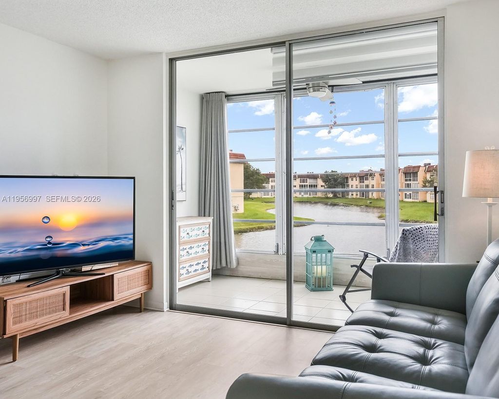 Photo of 8861 Sunrise Lakes Blvd #205, Sunrise, FL 33322 (MLS # A11956997)