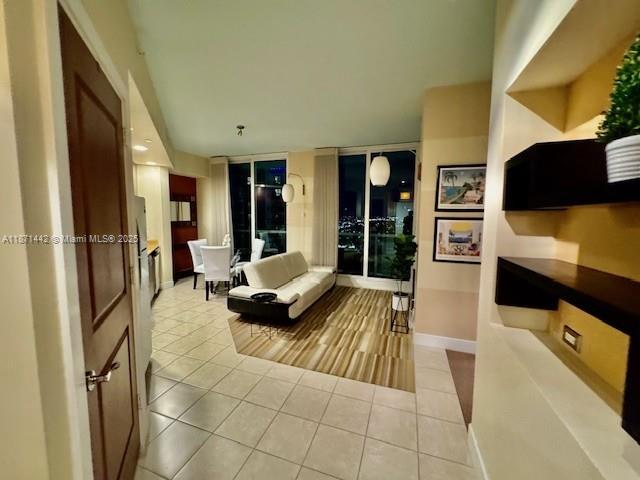 Beautiful furnished high floor studio professionally customized and converted to a 1-bedroom unit. This designer condo offers panoramic views of the city with floor to ceiling hurricane impact sliders and large windows. With a fully equipped kitchen including stainless steel appliances, granite counter tops, lots of built-ins, and private laundry. Strada offers gym, pool, spa, lounge, business center, garage, and with an expansive terrace to enjoy magnificent sunsets and night skies. Located in Flagler Village, less than a 10-minute bike ride to the beach and just a walk away from markets, restaurants and night life.