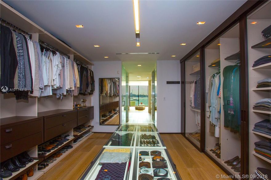 Warm & Modern Bayfront home. Completed in 2015 with uncompromising luxury details. Southern exposure with stunning views of Miami skyline & Biscayne Bay. Sophisticated European design, white oak floors, soaring ceilings, one of a kind rooftop glass-wall pool, expansive terrace with 360 degree views, home theater, fireplace, totally private top floor artist studio/office with amazing views, uniquely lit glass door elevator & much more. Minutes from SOBE, Lincoln Rd, Arts & Entertainment + Design District.