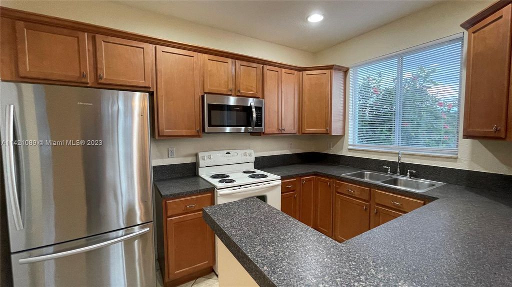 Photo of 3123 Laurel Ridge Cir #3123, Riviera Beach, FL 33404 (MLS # A11421089)