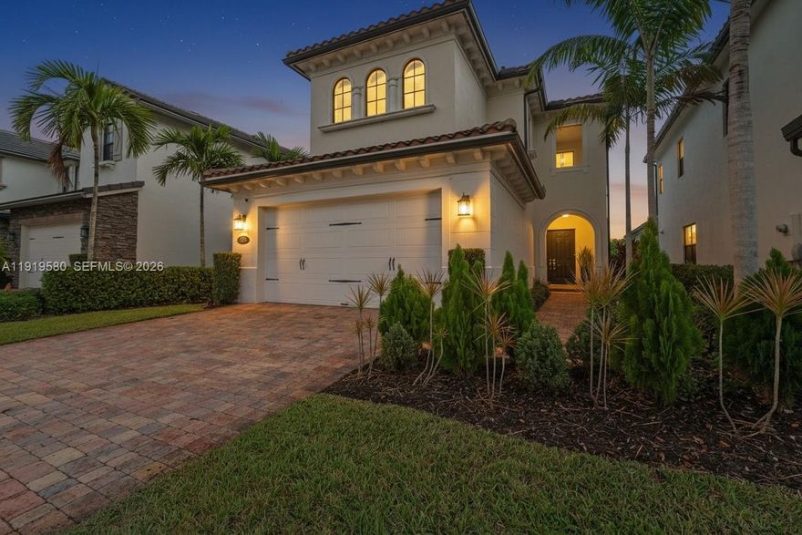 Enjoy serene water views from both the front and backyard of this Executive Series home—your own private oasis. This beautifully maintained 4-bedroom, 2.5-bath residence with a 2-car garage offers an open-concept layout with tile flooring throughout all main living areas, high-volume ceilings, and pre-wired surround sound in the living room for an open, bright, and inviting feel.
The spacious kitchen features stainless steel appliances, a walk-in pantry, and a professional range hood. Step outside to an extended patio ideal for outdoor dining, grilling, and entertaining. Additional features include impact windows and doors, a Tesla-ready charger outlet in the garage, and generous storage throughout.
Located in Raintree, a premier gated community offering resort-style amenities including a swimming pool, lounge area, children’s playground, clubhouse, and multipurpose room. HOA includes lawn care, sprinkler maintenance, and mulching for added convenience.