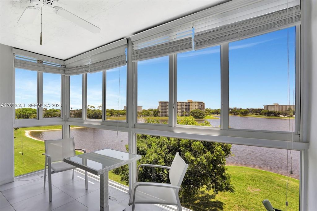 Photo of 3091 N Course Dr #502, Pompano Beach, FL 33069 (MLS # A12012402)