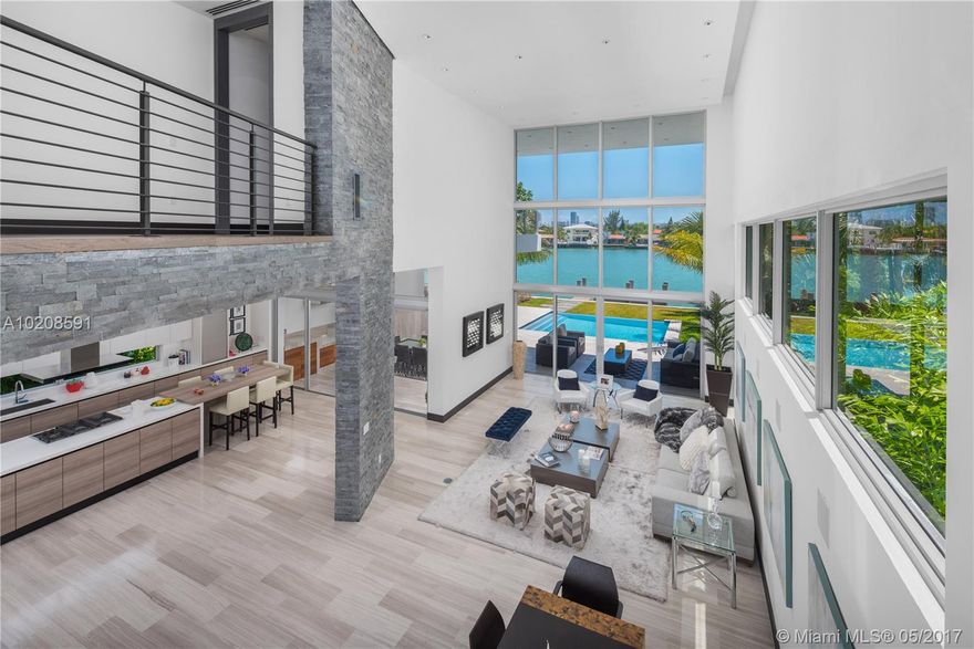 Amazing opportunity to own a brand new never lived in waterfront home in Miami Beach. At $800/sf this is the best deal for a new home in Miami Beach. Featuring a 6,144 sf interior w/ Vena Grigio Italian Marble, Italian kitchen w/ sub-zero & wolf appliances, TV Room, office, formal great room, dining room, maids quarters. 2nd floor boasts wood floors, grand master suite, 3 bedrooms & family room. Outdoor space w/ amazing views, wolf kitchen, pool, boat dock, new seawall. Nothing but the best finishes!