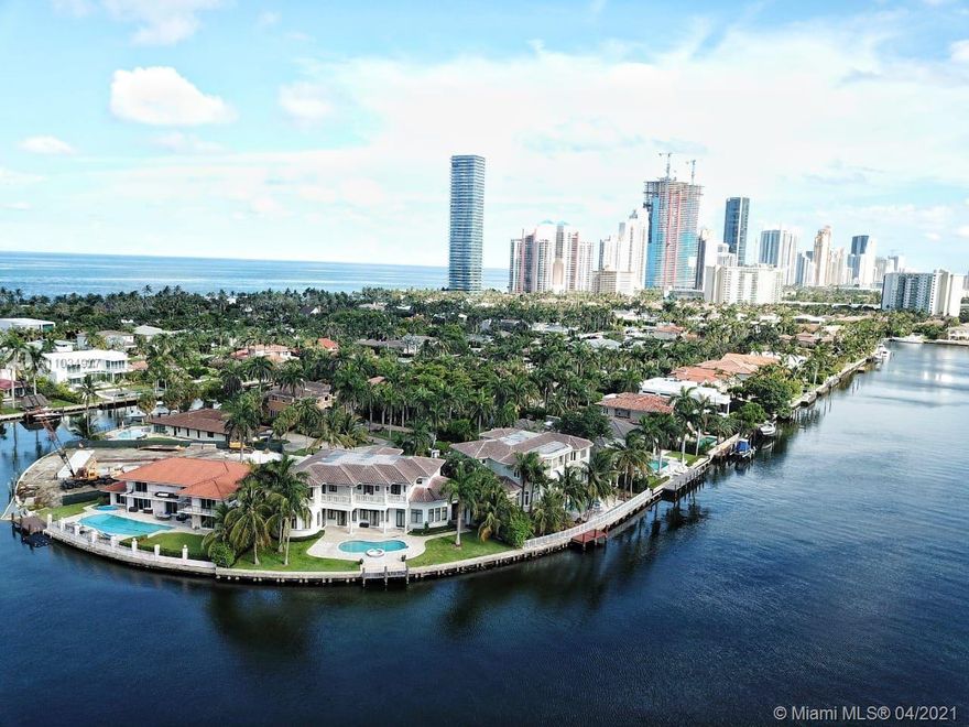 Exceptional Mansion on 150 feet of the Intracoastal Waterway. State of the art home with seven bedrooms, seven and 1/2 bathrooms, a theatre, elevator, gourmet Kitchen, impact doors and windows, and many upgrades. Gated for privacy. * Chandeliers, windows curtains, and blackouts are not included in the sale*